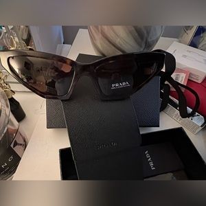 Never worn Prada sunglasses